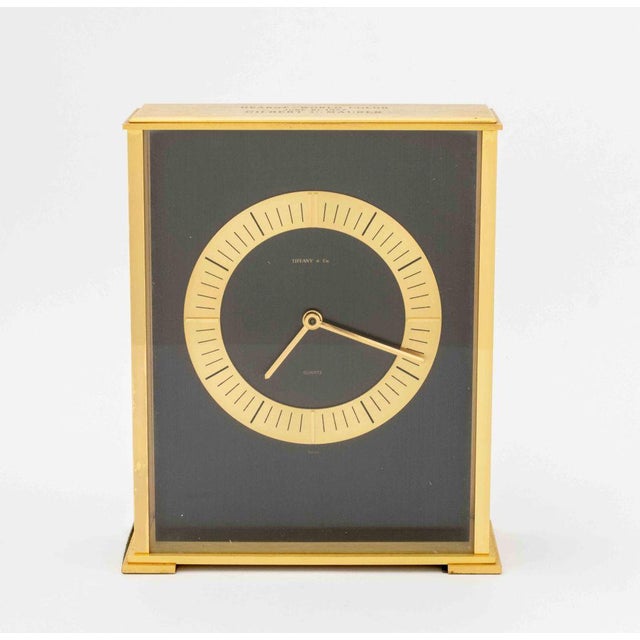 Tiffany and Company Brass Mantle Clock, the black dial marked "Tiffany &amp; Co. / Quartz", engraved "Hearst - World Color...