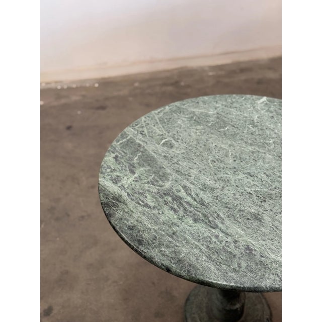 W30 D30 H29.5 KC28.5 Vintage bistro table in solid marble construction. Item has no large visible breaks or chips. Table...