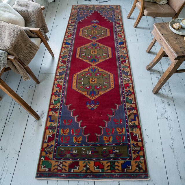 Woven in the Tashpinar region of Central Anatolia during the 1960s, this hand-knotted runner rug exemplifies the enduring...