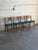 Beautiful set of 4 vintage Danish Mid-Century Modern dining chairs crafted in teak with elegantly curved ladder-back...