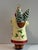 Patricia Breen “Holly’s” Santa collectible Christmas ornament featuring an elaborate Santa dressed in a cream coat...