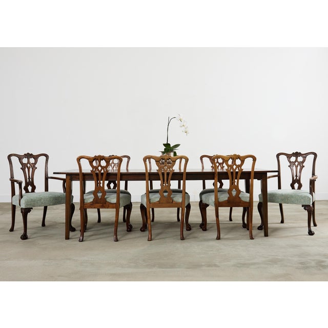 Grand set of twelve late 19th/early 20th century fine English dining chairs crafted from mahogany. The chairs have been...