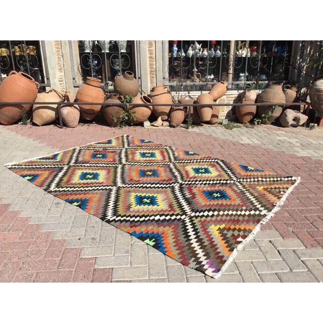 This beautiful, vintage, handwoven kilim is approximately 50 years old. It is handmade, of very fine quality hand spun...