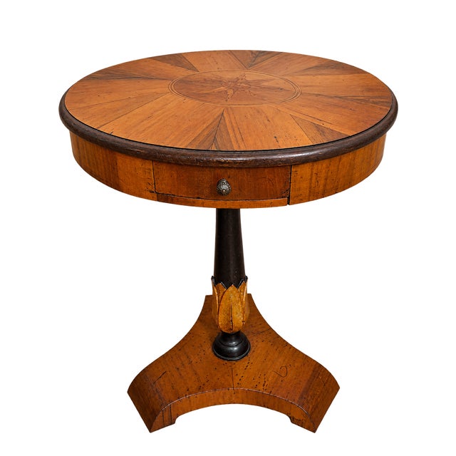 Exquisite petite Biedermeier table with drawer. Sunburst pattern inlay on the oval top. Black, ebonized pedestal with gold...