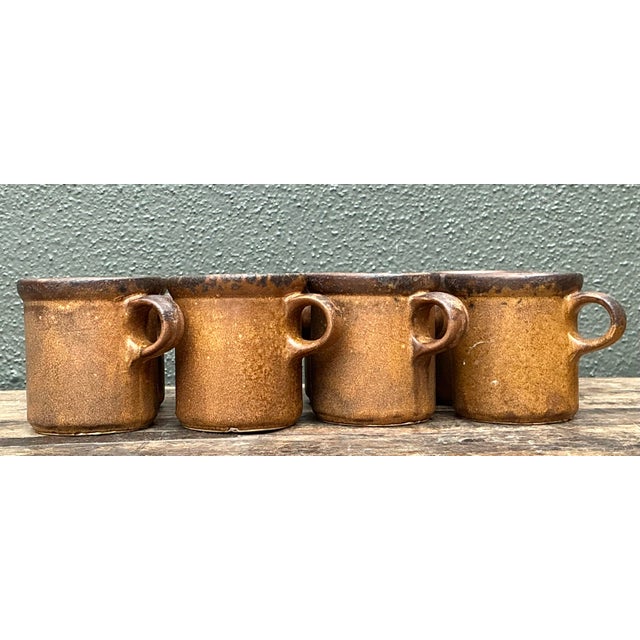Elevate your morning ritual with this inviting set of eight vintage Mid-Century Modern coffee mugs. Crafted in the USA,...