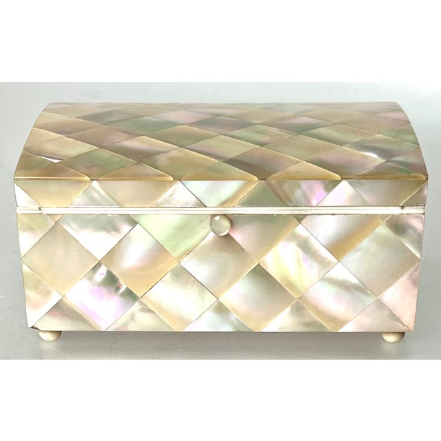 A truly exceptional and beautiful box, made of mosaic iridescent shell tiles that are cut with geometric precision to form...