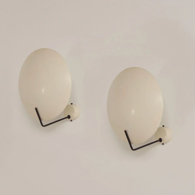 Rare set of white Italian wall or ceiling lamps (model 232) designed by Bruno Gatta for Stilnovo in 1962. The design is...