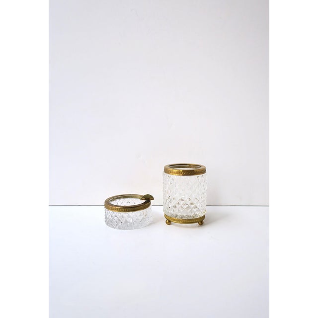 A two‑piece (2) vanity or smoking set in cut crystal with bright gilt bronze mounts, Hollywood Regency design, circa early...