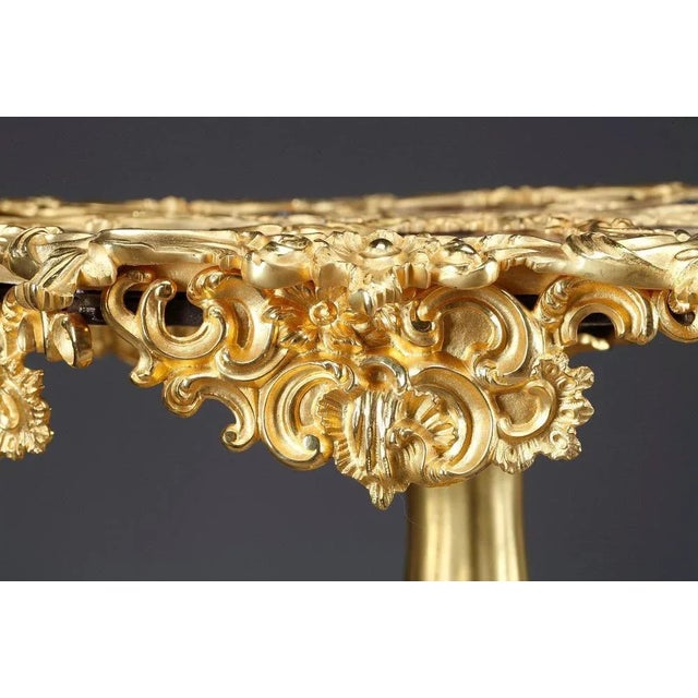 This one-of-a-kind gueridon table crafted in the louis xv style, is a tour de force of porcelain design. Exotic fruits,...