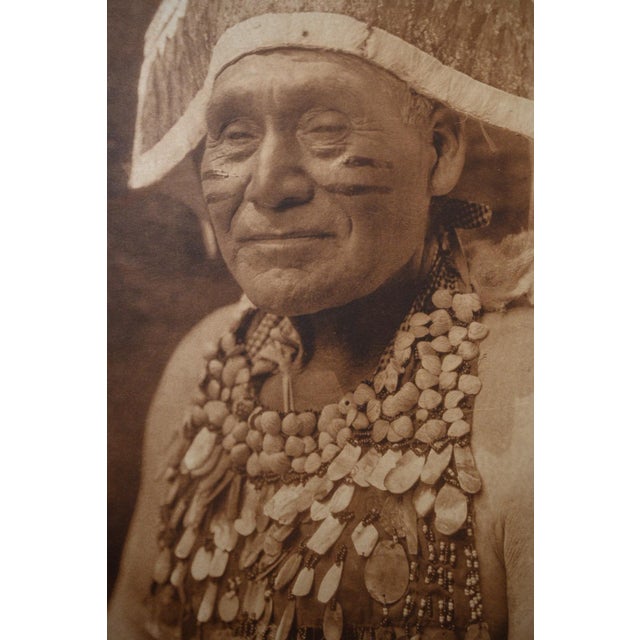 An original vintage photogravure from Edward S. Curtis's monumental The North American Indian. Hupa Jumping Dance Costume...