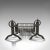 This is an antique fireplace set. An English, cast iron fire basket and pair of andirons, dating to the late Victorian...