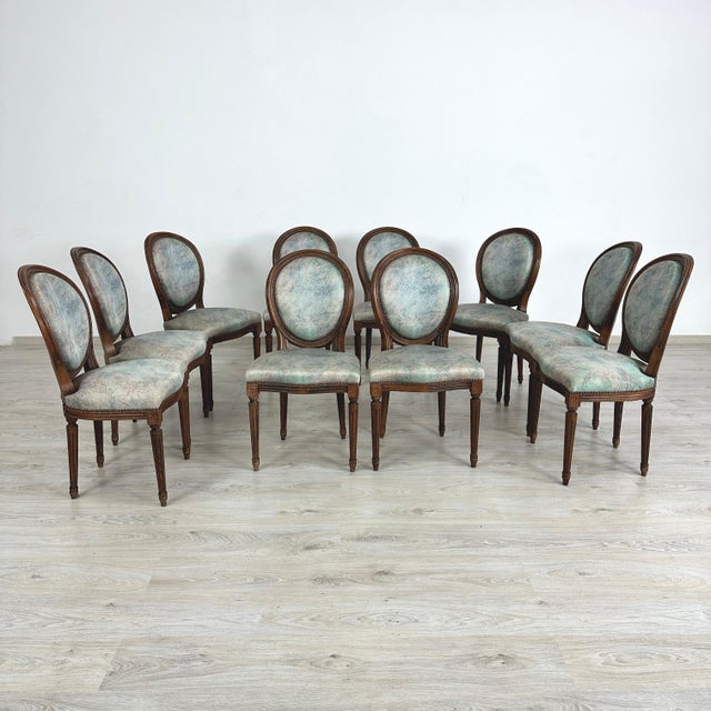Dimensions: H 35.7” x W 19” x SD 16.3” x SH 18.7” Set of 10 Vintage French Louis XVI style Medallion back dining chairs....