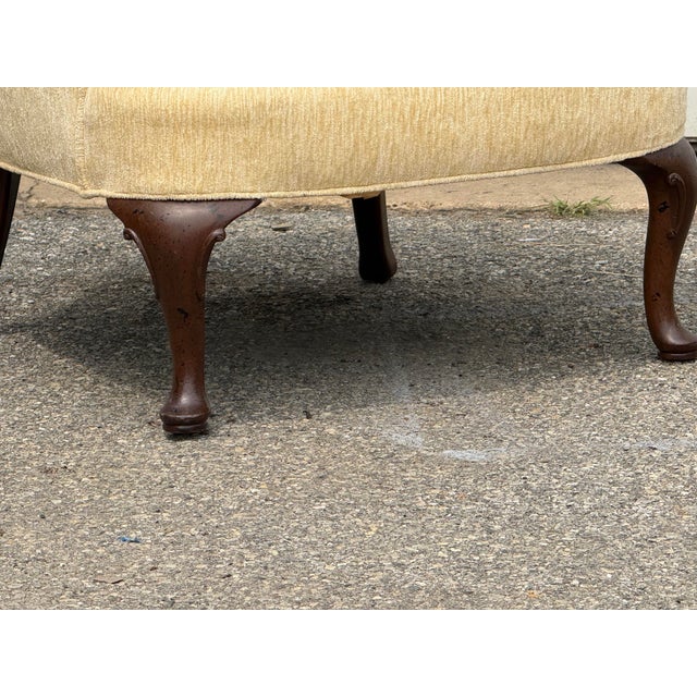 Beautiful vintage pair of Henredon low-back club chairs, featuring an elegant combination of traditional detailing and...