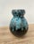 Elegant chamotte clay vase with a generous body and a narrow neck, finished with a thick, rounded lip. The piece is...