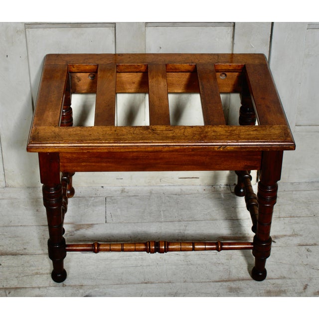 A Superb Victorian luggage stand. Made from Teak, with slatted rungs all raised on hand turned legs and central stretcher....