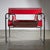 Introducing the Wassily Chair, a well-known piece designed by Marcel Breuer. This chair is available in a bright red...