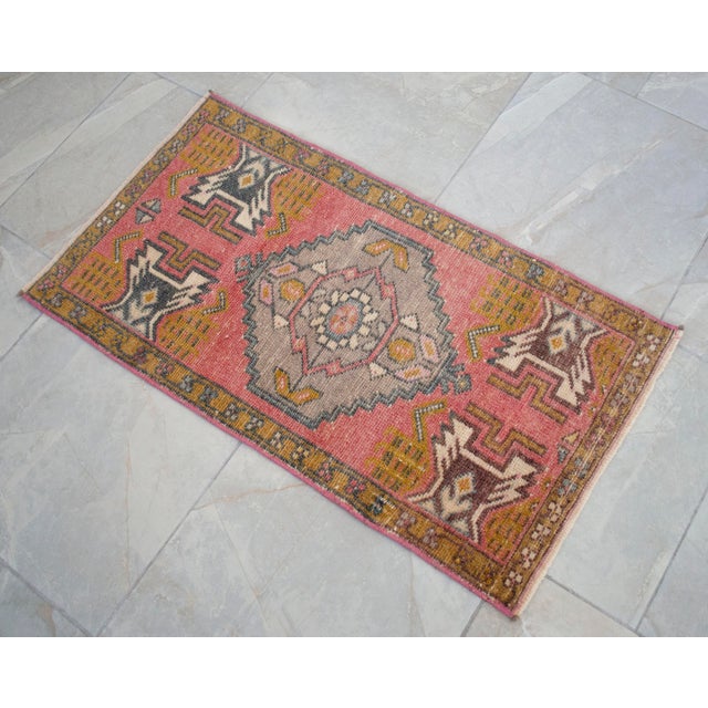 a Vintage Turkish Small yastik rug, rose background rug perfect for entryway, bath or in front of the kitchen sink. Or for...