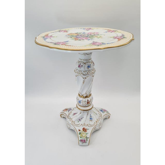 An elegant decorative porcelain table made by the renowned German manufacturer von Schierholz (Plaue, Thuringia). The...