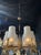 Modern Murano Glass Chandelier. Featuring textured glass and 6 brass arms. A great fixture that would be great with a...