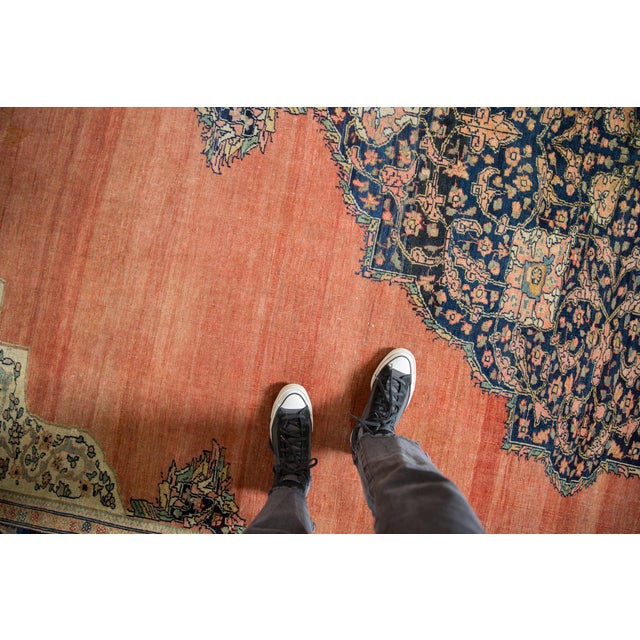 :: Oversize center medallion with interior interconnected scrolling floral arabesques and buds stemming therefrom. Adorned...