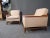 Pairing a warm beige upholstery with walnut frames, this vintage pair of lounge chairs are a versatile way to add Mid-...
