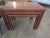 A nest of 3 teak Danish Modern nesting tables by Vejle Stole, Denmark. Circa. 1970. Teak patchwork veneer top surfaces,...