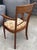 Upholstered seat in a beautiful, thick fabric in very good condition. Cherry wood frame with some signs of wear and minor...