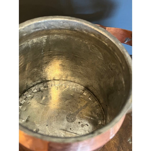 Offered is a beautiful antique copper tea kettle featuring exceptional handmade craftsmanship. This piece showcases a...