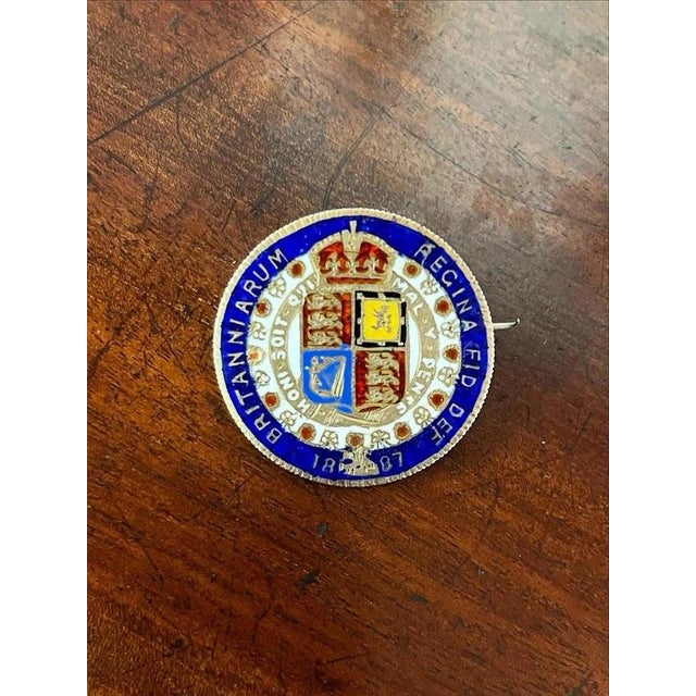 Late 19th Century Victorian Enamelled Silver Florin Coin Brooch Material: Silver and Enamel A charming late 19th century...