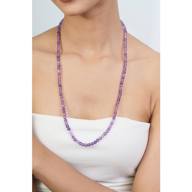 Add a rich touch of purple to your jewelry collection with this elegant 26-inch beaded necklace, featuring 116 carats of...