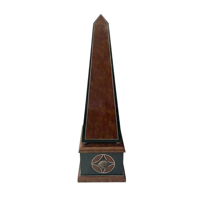 The VTG Maitland-Smith Leather Obelisk with brass sun Medallions is a stunning decorative piece featuring a neoclassical...