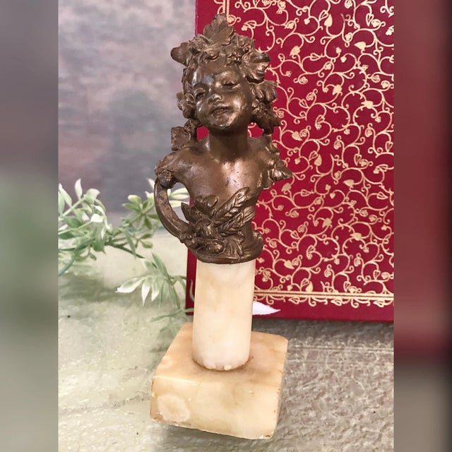 This is for a wonderful small Victorian / Art Nouveau / Edwardian ChildSpelter statue. The metal bust sits on a stone...