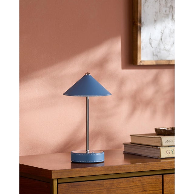 Illuminate your space with a touch of mid-century modern flair, courtesy of the Nomelle accent table lamp. Standing at an...