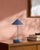 Illuminate your space with a touch of mid-century modern flair, courtesy of the Nomelle accent table lamp. Standing at an...
