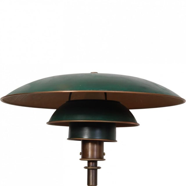 Poul henningsen ph 4/3 table lamp with green shades and a copper frame. The lamp is from the mid-late 1920s and appears in...
