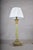 Neoclassical column table lamp dating to the 1930s. The natural green onyx column is topped by a Corinthian capital in...