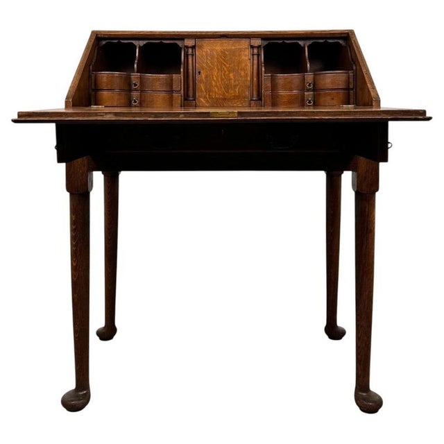 An exceptionally well-crafted 20th-century bureau, beautifully constructed in golden oak and distinguished by its fitted...