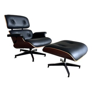 Herman Miller Eames Chair and Ottoman, Black Leather and Cherry, 50th Anniversary Edition For Sale