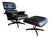 Herman Miller Eames Chair and Ottoman, Black Leather and Cherry, 50th Anniversary Edition For Sale