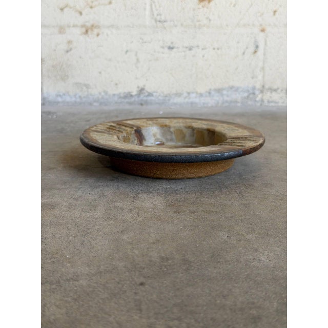 Vintage 1970s Danish Mid-Century Modern studio ceramic plate or shallow bowl features a deeply tactile abstract design...
