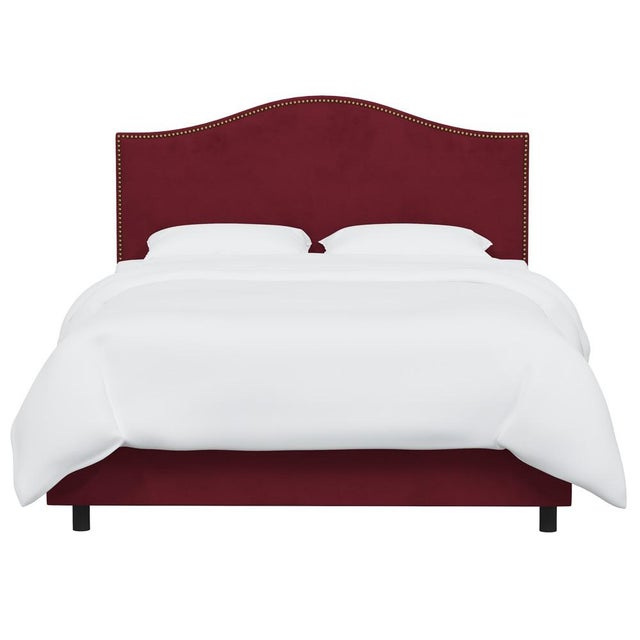 Give your interior a lift with the Bed. Featuring the delicate curves of a classic camelback design, with subtle nailhead...