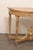 An elegant French Neoclassical carved giltwood demi-lune console table, with exceptional marble top, from the early 19th...