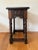 Antique solid oak side table made and stamped Belgium features four barley twist legs and hand carved motifs on both the...