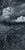 This oil on canvas artwork presents a dramatic interplay between tumultuous clouds and fragmented landforms, evoking a...