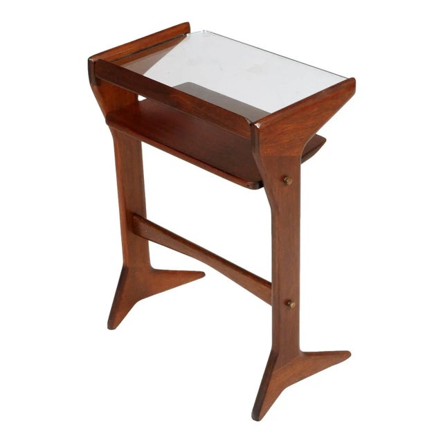 - Console or bedside table - Designed by Cesare Lacca - Mid-century modern style - In mahogany with glass top This piece...
