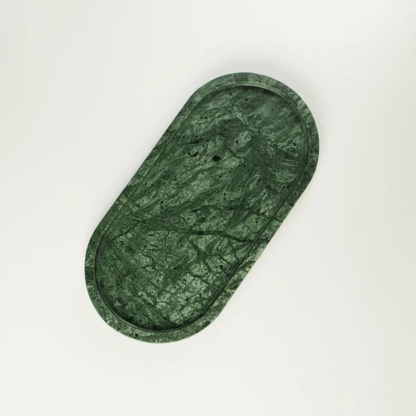This oval vanity tray is hand-carved from a single solid block of verde Indian marble, sourced from the quarries of...