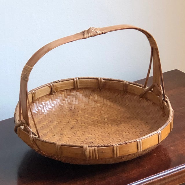 A beautiful mid-20th century handwoven Chinese basket with a rich, warm patina that only comes with age. Gorgeous!