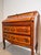 Elegant secretary desk in warm walnut veneer, richly decorated with refined marquetry inlays. The drop-front writing...