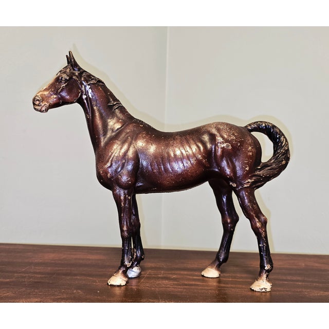 A beautifully aged, vintage cast iron horse figurine, crafted in the mid‑20th century and assembled in the classic...