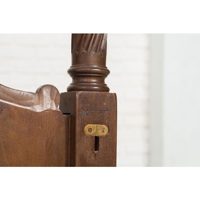 Decorative twin bed set crafted in Spain during the mid-20th century, consisting of two matching carved wooden beds with...